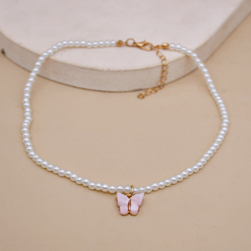 Elegante weiße Perle Choker kleine runde Perle Hochzeit Schmetterling Halskette