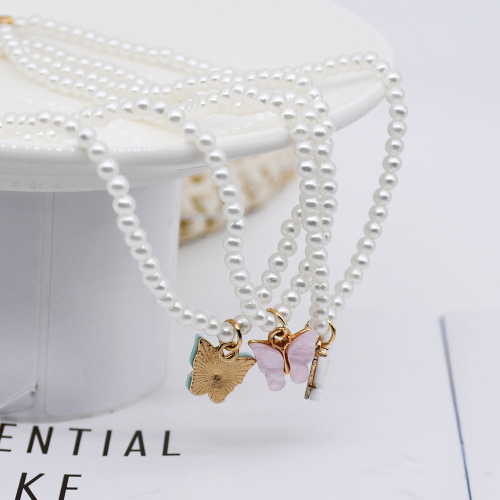 Elegante weiße Perle Choker kleine runde Perle Hochzeit Schmetterling Halskette