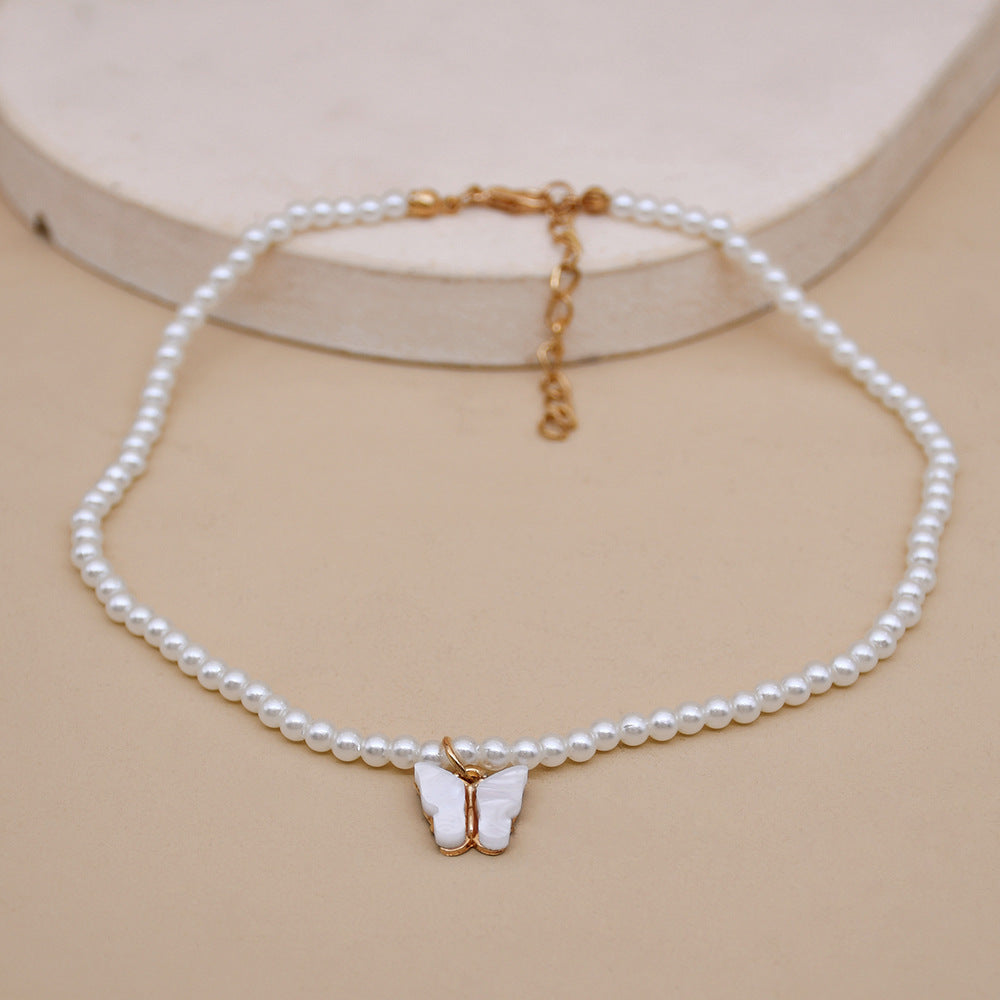 Elegante weiße Perle Choker kleine runde Perle Hochzeit Schmetterling Halskette