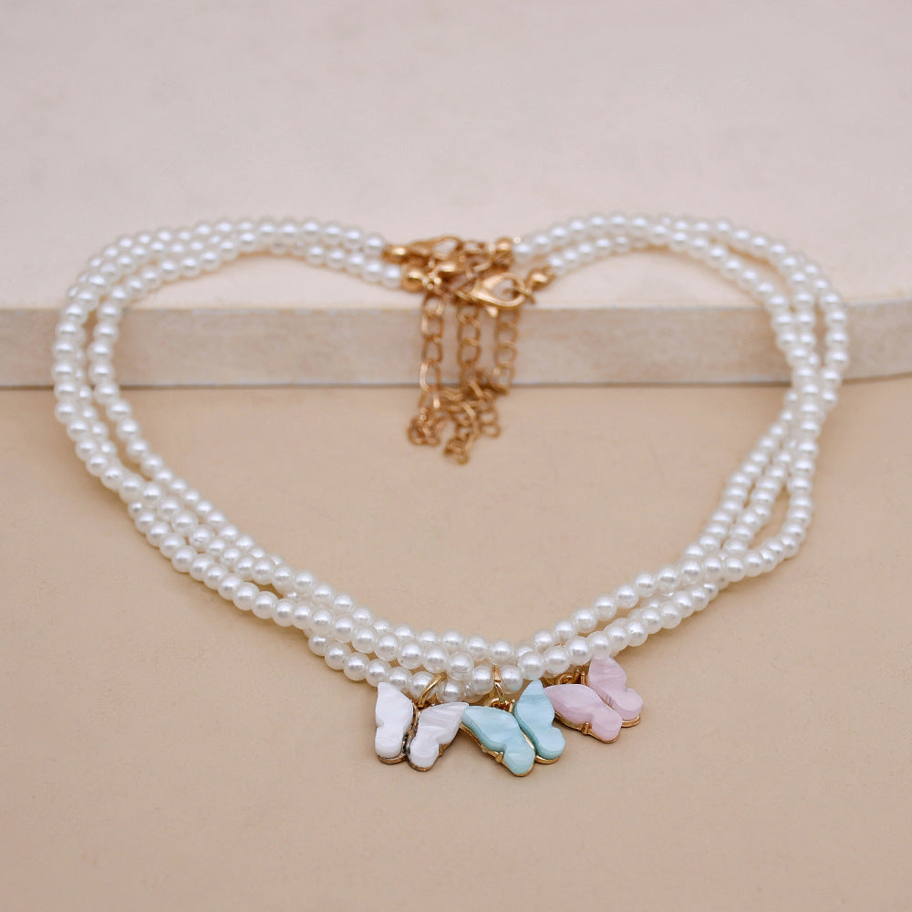Elegante weiße Perle Choker kleine runde Perle Hochzeit Schmetterling Halskette